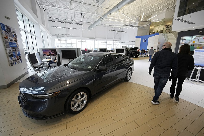 A 2024 Honda Accord sedan sits on the floor of a dealership at Highlands Ranch, Colo., in April. The Commerce Department reported its key index of prices rose in April even though consumer spending rebounded. The latest inflation figures arrive as the Fed debates whether to raise interest rates again in coming months.
(AP/David Zalubowski)