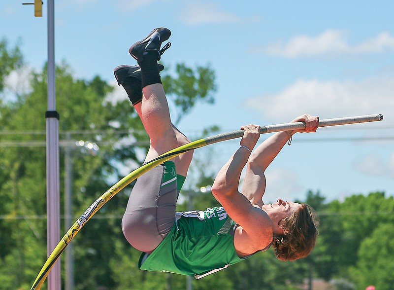 Luke LePage of Blair Oaks launches himself up to try and clear the bar during the boys pole vault in the 2021 Class 3 track and field state championships at Adkins Stadium. (News Tribune file photo)