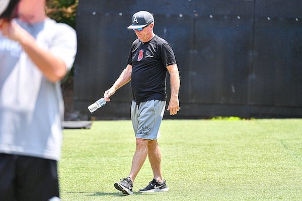 Arkansas head coach Dave Van Horn walks to visit with players, Friday, May 26, 2023, during a practice session at the Hoover High School baseball complex in Hoover, Ala.