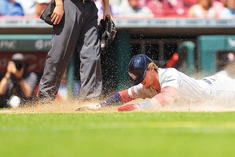 Nolan Gorman of the Cardinals scores a run on a wild pitch during the eighth inning of Thursday afternoon’s game against the Reds in Cincinnati. (Associated Press)