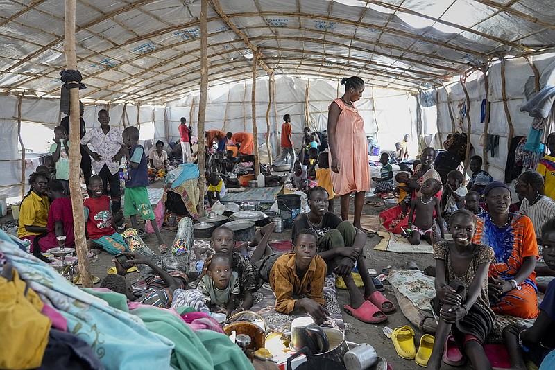 South Sudanese shelter in a transit center in Renk, South Sudan Wednesday, May 17, 2023. Tens of thousands of South Sudanese are flocking home from neighboring Sudan, which erupted in violence last month. (AP Photo/Sam Mednick)