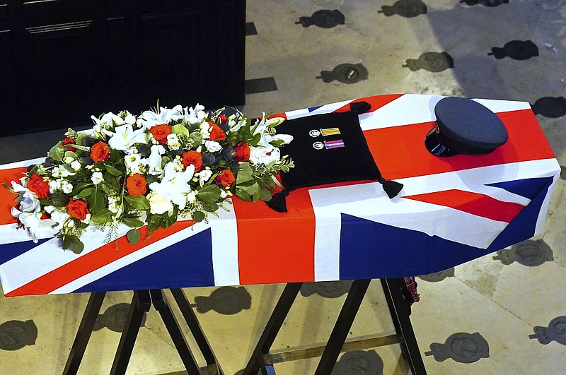 A view of the coffin of former RAF Sergeant Peter Brown adorned with the Union flag and his medals, during his funeral service at St Clement Danes Church, in London, Thursday May 25, 2023. Jamaican born Flight Sgt. Peter Brown who flew bombing missions in World War II after volunteering for the Royal Air Force died in December, aged 96. Volunteers tried to track down family and people who knew him. Word of that search drew interest from others who didn't want him to be forgotten for the service he offered in Britain's darkest hour. (Victoria Jones/PA via AP)