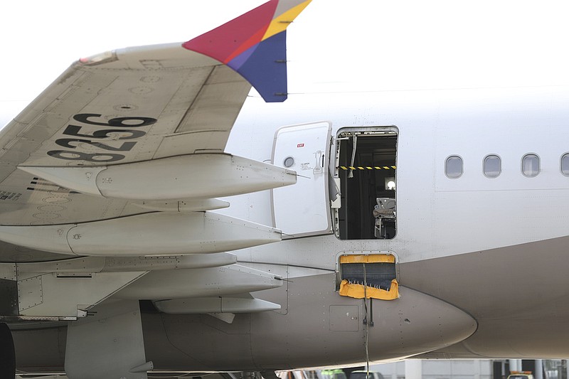 An Asiana Airlines plane is parked as one of the plane's doors suddenly opened at Daegu International Airport in Daegu, South Korea, Friday, May 26, 2023. (Yun Kwan-shick/Yonhap via AP)
