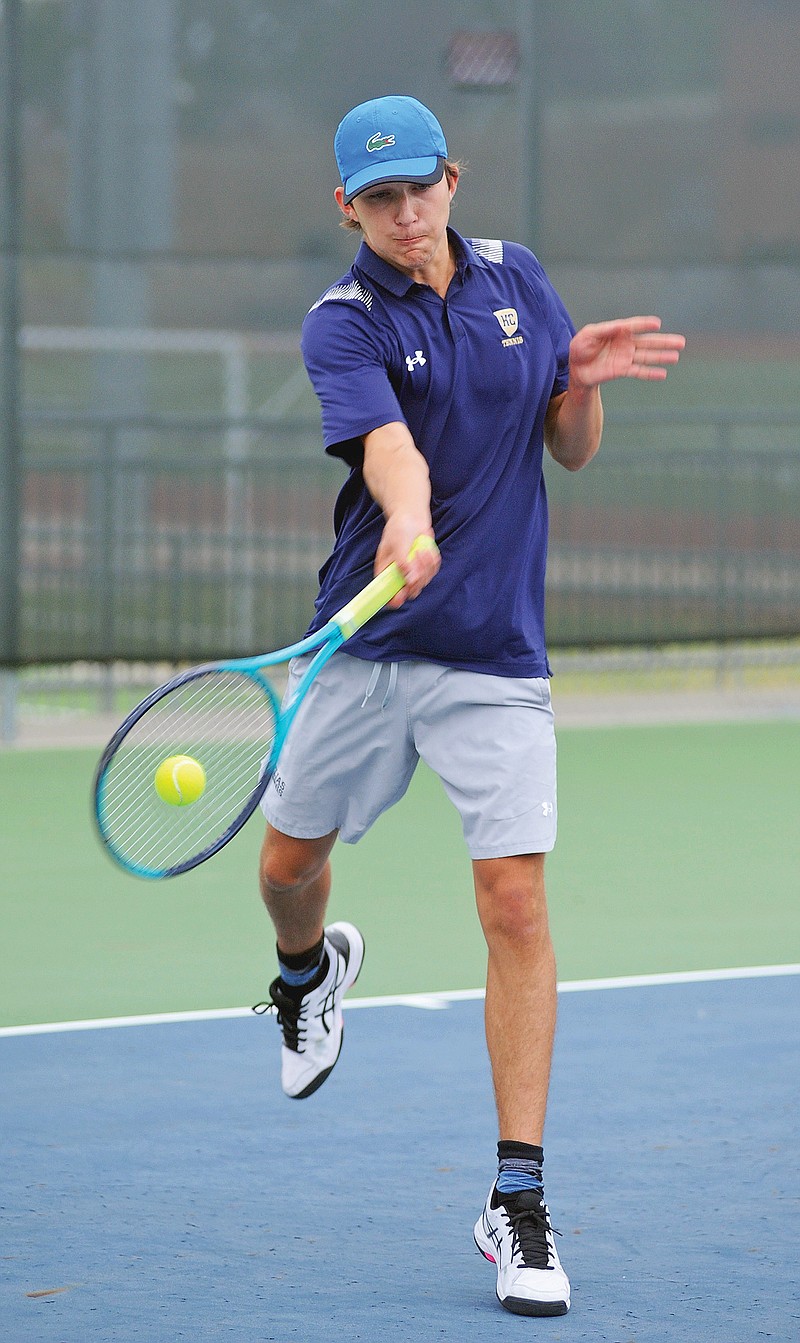 Jonah Lanigan of Helias returns a shot during his doubles match earlier this month against Platte County in a Class 2 state quarterfinal dual at the Crusader Athletic Complex. (Shaun Zimmerman/News Tribune)