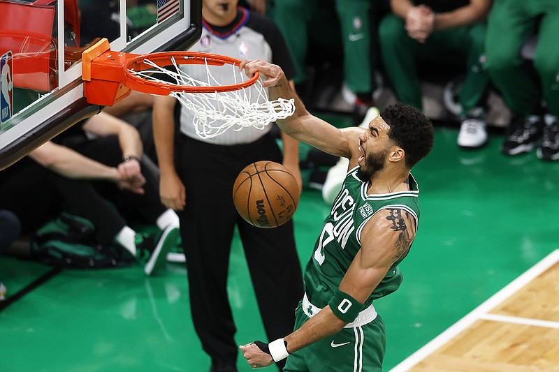 Jayson Tatum of the Celtics dunks during the first half in Thursday night's Game 5 of the Eastern Conference finals against the Heat in Boston. (The Associated Press)