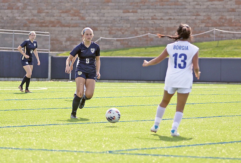 Rae Bohlken of Helias battles for control of the ball against St. Francis Borgia’s Macey Levin during a match this season at the Crusader Athletic Complex. (Greg Jackson/News Tribune)