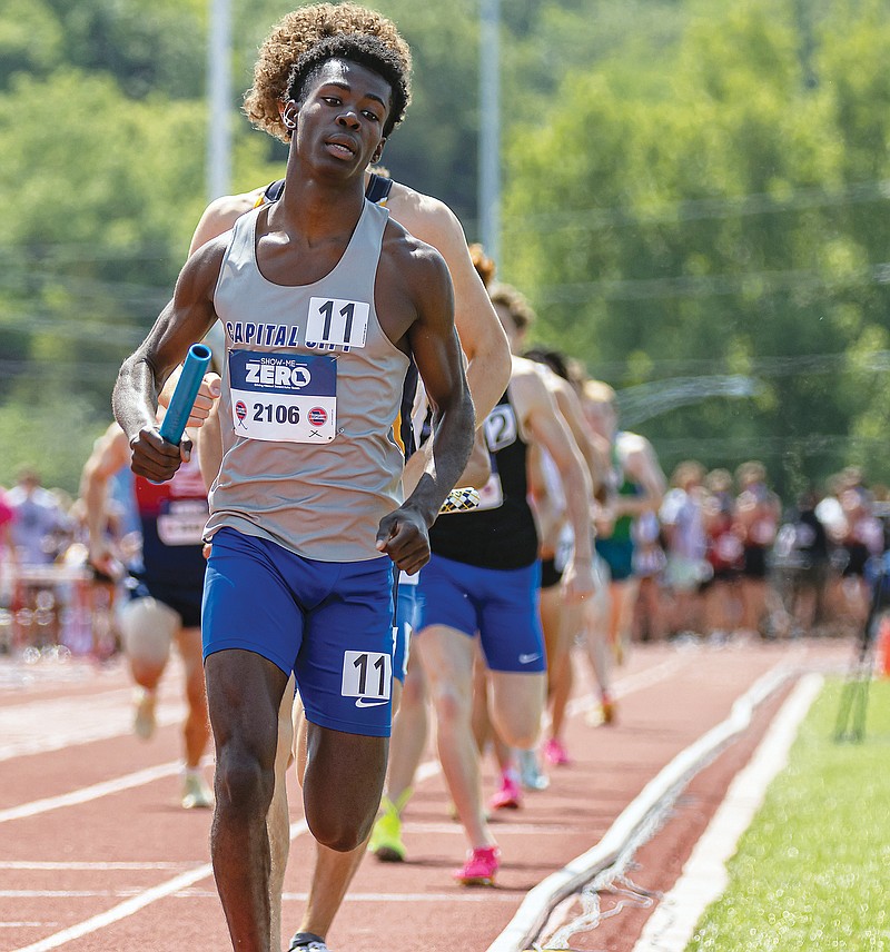 Capital City's Sincere Davis runs a leg in the boys 4x800-meter relay Saturday in the Class 5 track and field state championships at Adkins Stadium. (Josh Cobb/News Tribune)