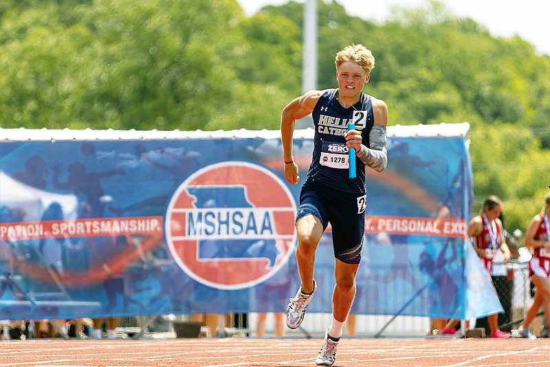 Matthew Malmstrom of Helias sprints during his leg of the boys 4x200-meter relay final Saturday in the Class 4 track and field state championships at Adkins Stadium. (Josh Cobb/News Tribune)