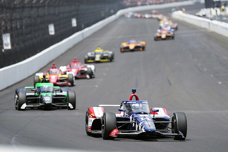 Santino Ferrucci leads the field into the first turn Sunday during the Indianapolis 500 at Indianapolis Motor Speedway in Indianapolis. (Associated Press)