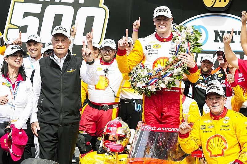 Josef Newgarden celebrates Sunday with his team and car owner Roger Penske after winning the Indianapolis 500 at Indianapolis Motor Speedway in Indianapolis. (Associated Press)