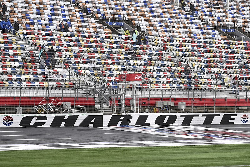 Rain caused the postponement Sunday of the NASCAR Cup Series race at Charlotte Motor Speedway in Concord, N.C. (Associated Press)