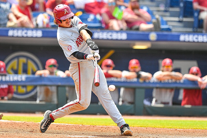 Arkansas third baseman Caleb Cali (6) hits a single, Saturday, May 27, 2023, during the ninth inning of the Razorbacks’ 5-4 loss to the Texas A&M Aggies in the semifinals of the 2023 SEC Baseball Tournament at the Hoover Metropolitan Complex in Hoover, Ala. Visit nwaonline.com/photo for today's photo gallery..(NWA Democrat-Gazette/Hank Layton)