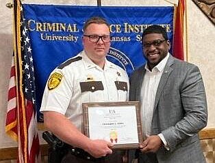 Lt. Christopher Grider (left) and Jefferson County Sheriff Lafayette Woods Jr. display a certificate of completion from the Criminal Justice Institute's School of Law Enforcement Supervision at Little Rock. (Special to The Commercial)