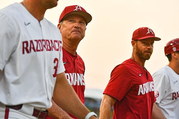 Arkansas head coach Dave Van Horn (center) walks to speak to his team, Thursday, May 25, 2023, following the Razorbacks’ 5-4 win over the LSU Tigers at the 2023 SEC Baseball Tournament at the Hoover Metropolitan Complex in Hoover, Ala.