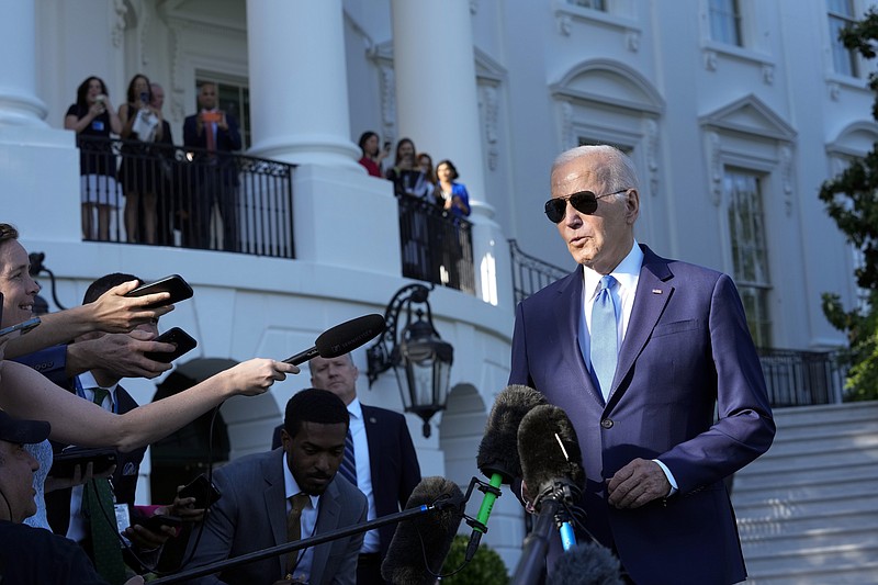 FILE - President Joe Biden talks with reporters on the South Lawn of the White House in Washington, Friday, May 26, 2023, as he heads to Camp David for the weekend. Biden and House Speaker Kevin McCarthy reached an “agreement in principle” to raise the nation’s legal debt ceiling late Saturday as they raced to strike a deal to limit federal spending and avert a potentially disastrous U.S. default. (AP Photo/Susan Walsh, File)