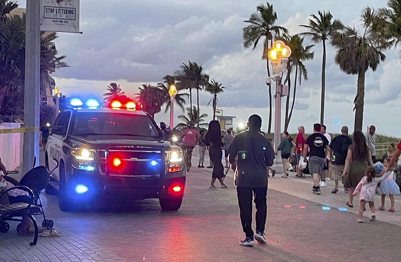 Police respond to a shooting near the Hollywood Beach Broadwalk in Hollywood, Fla., Monday evening, May 29, 2023. (Mike Stocker/South Florida Sun-Sentinel via AP)