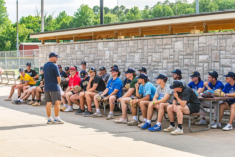 Renegades head coach Mike DeMilia addresses the team before its first practice Tuesday night at Vivion Field. The Renegades open the MINK League season tonight with a home game against the Sedalia Bombers. (Ken Barnes/News Tribune)