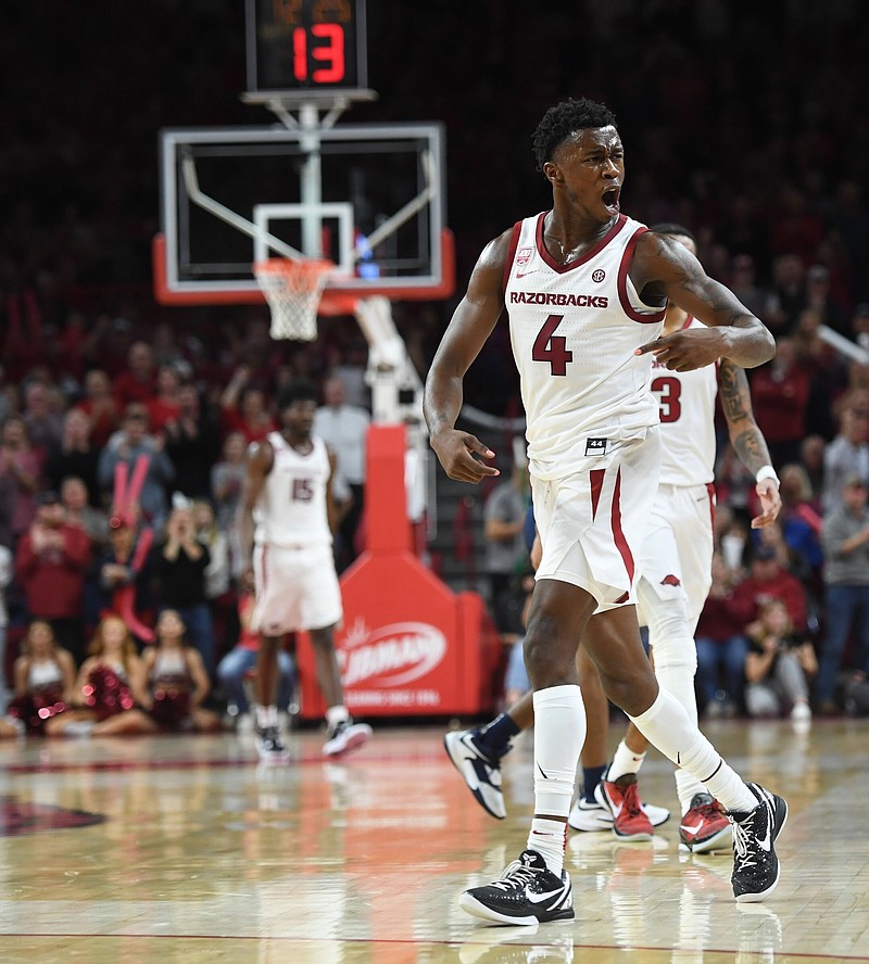 Arkansas guard Davonte Davis (4) celebrates Tuesday, Dec. 6, 2022, during the second half of the Razorbacks' 65-58 win over UNC-Greensboro in Bud Walton Arena in Fayetteville. 
(NWA Democrat-Gazette/Andy Shupe)