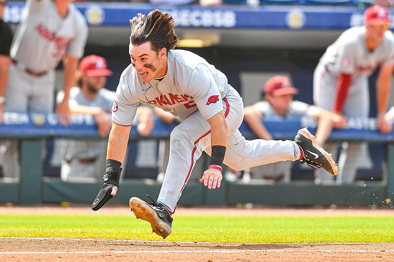 Arkansas second baseman Peyton Holt slides into home plate during the Razorbacks’ SEC Baseball Tournament game against Texas A&M on Saturday in Hoover, Ala. Holt is batting .488 with a home run and 11 RBI in the past 11 games for Arkansas, which opens NCAA Tournament play Friday against Santa Clara in Fayetteville.
(NWA Democrat-Gazette/Hank Layton)