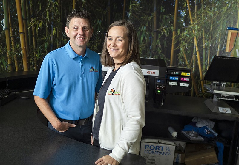 John and Mara Dougherty pose for a portrait at Big Frog Custom T-Shirts in Bentonville. Visit nwaonline.com/photos for today’s photo gallery.
(NWA Democrat-Gazette/Charlie Kaijo)