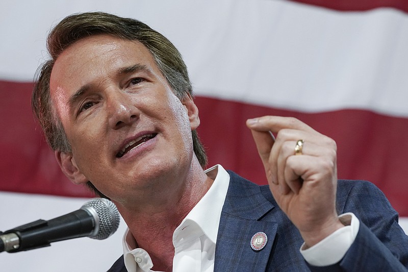 FILE - Virginia Gov. Glenn Youngkin speaks prior to signing the budget at a ceremony at a grocery store June 21, 2022, in Richmond, Va. Youngkin is set to issue a third round of endorsements in Virginia legislative races, backing 19 more Republican candidates, including six who are in contested primaries. Among those set to receive the governor’s backing Thursday, May 18, 2023 are Emily Brewer and Tara Durant, both members of the House of Delegates facing spirited challenges for the GOP nomination in state Senate races.(AP Photo/Steve Helber, File)