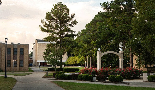 The College of Engineering and Computer Science at Arkansas State University in Jonesboro is shown behind the school's Memorial Arch in this undated courtesy photo. (Arkansas State University photo)