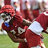 Arkansas defensive back Quincey McAdoo moves past a teammate Thursday, March 30, 2023, while taking part in a drill during practice at the university practice facility in Fayetteville.