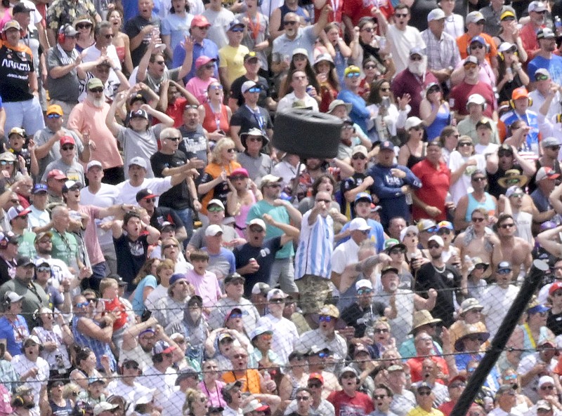 A tire flies near a section of grandstand in the second turn Sunday after a collision between Kyle Kirkwood and Felix Rosenqvist during the Indianapolis 500 at Indianapolis Motor Speedway in Indianapolis. (Associated Press)