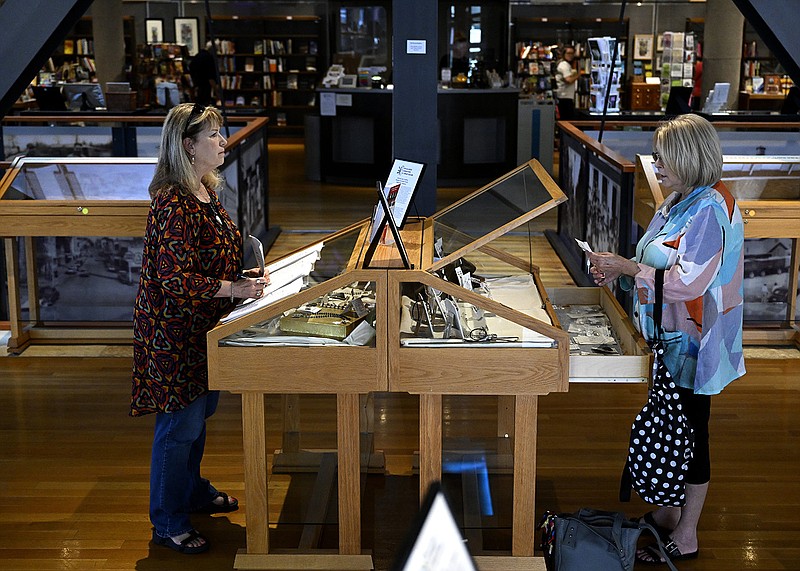 Cindy Kopack (left) performs inventory with the help of her friend, Jackie Cossey, as she collects her jewelry for sale at the Central Arkansas Library System’s Galleries & Bookstore at Library Square in Little Rock on Tuesday.
(Arkansas Democrat-Gazette/Stephen Swofford)