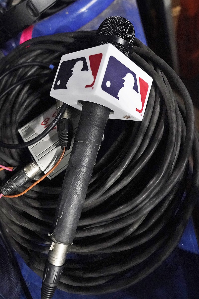 A microphone belonging to a field reporter for the Padres sits on top of audio cables during Wednesday night's game against the Marlins in Miami. Major League Baseball took over broadcasts of the Padres' games Wednesday. (Associated Press)