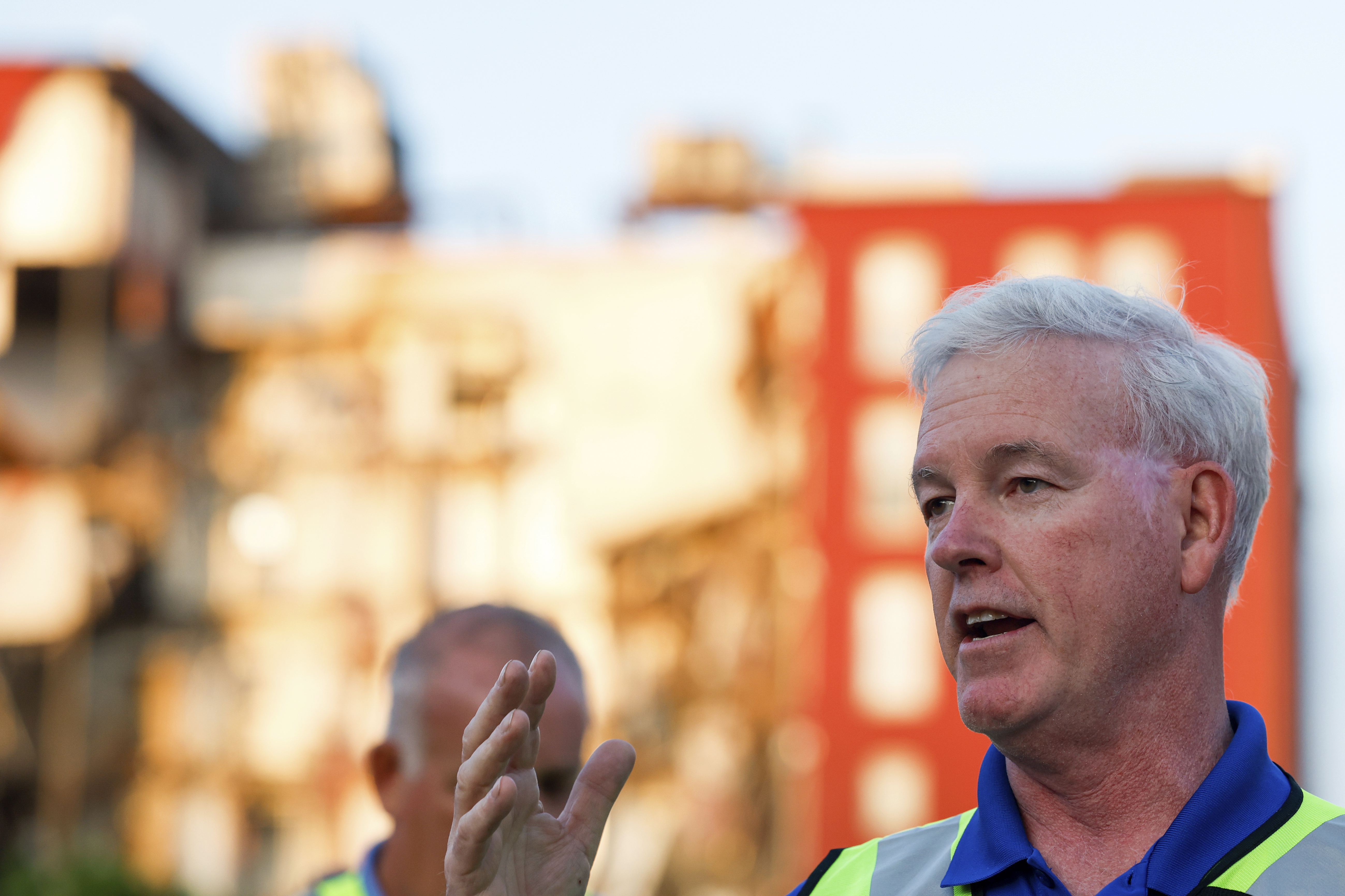 Davenport Mayor Mike Matson gives an update to media, residents and onlookers after a partial building collapse on the 300 block of Main Street, Sunday, May 28, 2023, in Davenport, Iowa. (Nikos Frazier/Quad City Times via AP)