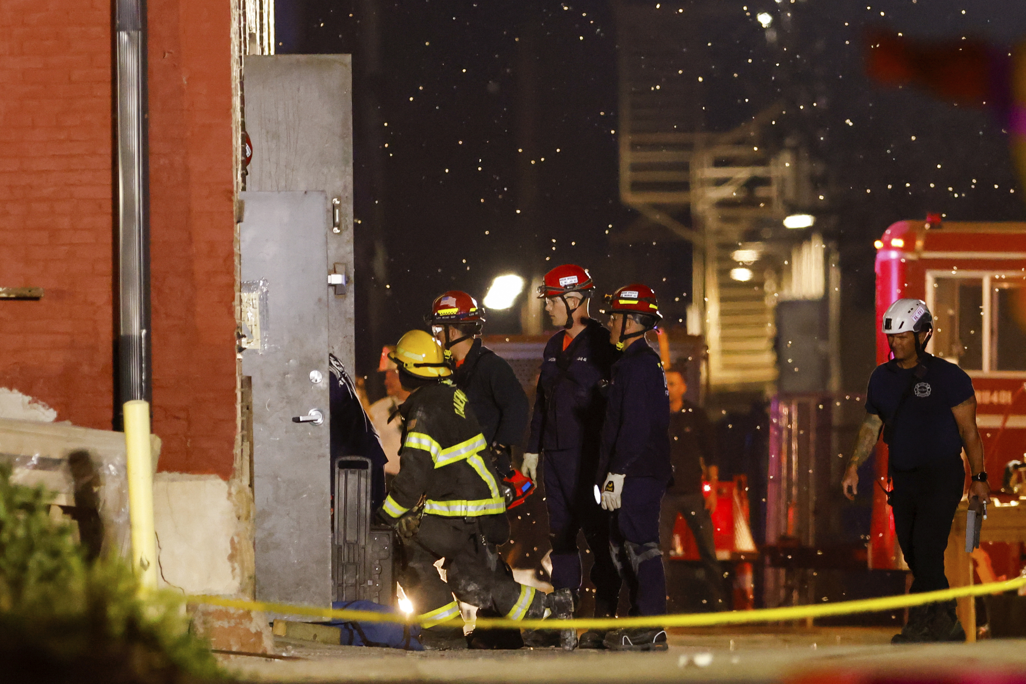 Emergency crews work the scene of a partial building collapse on the 300 block of Main Street, Sunday, May 28, 2023, in Davenport, Iowa. (Nikos Frazier/Quad City Times via AP)