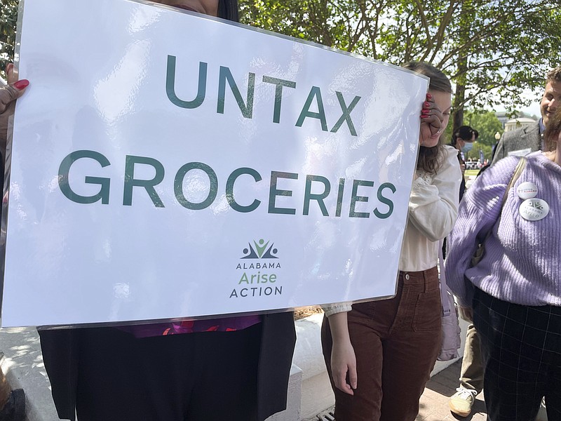 Proponents of a tax removal on groceries hold a rally April 11, 2023, outside the Statehouse in Montgomery, Ala. Alabama lawmakers on Thursday, June 1, 2023 approved legislation that would remove half of the state's 4% sales tax on groceries. (AP Photo/Kim Chandler)
