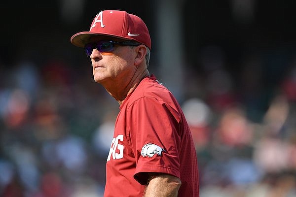 Arkansas coach Dave Van Horn leaves the field Friday, June 2, 2023, after removing second baseman Peyton Holt during the ninth inning of the Razorbacks’ 13-6 win over Santa Clara in the first round of the NCAA Fayetteville Regional at Baum-Walker Stadium in Fayetteville. Visit nwaonline.com/photo for today's photo gallery. ...(NWA Democrat-Gazette/Andy Shupe)