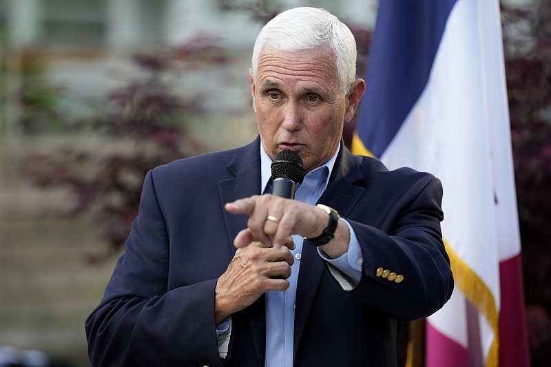 FILE - Former Vice President Mike Pence speaks to local residents during a meet and greet, May 23, 2023, in Des Moines, Iowa. The Department of Justice has informed former Vice President Mike Pence’s legal team that it won't  pursue criminal charges related to the discovery of classified documents at his Indiana home.  (AP Photo/Charlie Neibergall, File)