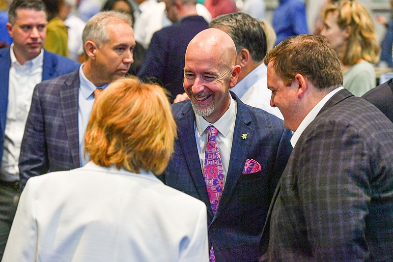 Jacob Oliva (center), secretary of the Arkansas Department of Education, visits with guests after speaking Friday, June 2, 2023, at the Fort Smith Regional Chamber of Commerce’s First Friday Breakfast Series inside the Reynolds Room of the Smith-Pendergraft Campus Center at the University of Arkansas-Fort Smith in Fort Smith. (River Valley Democrat-Gazette/Hank Layton)