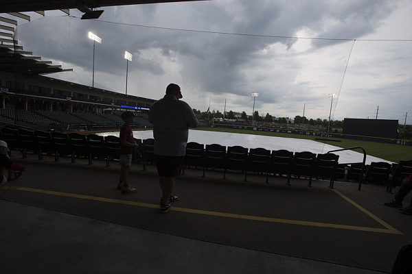 Fans wait for the rain to stop Saturday June 3, 2023 at the NCAA Regional Baseball Tournament at Baum-Walker Stadium in Fayetteville.