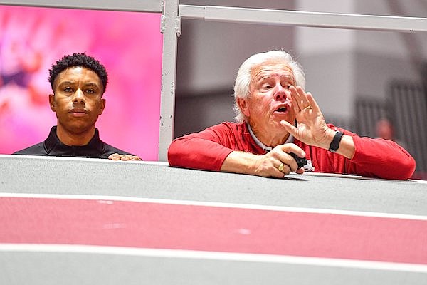 Arkansas coach Lance Harter (right) shouts instructions during the SEC Indoor Track and Field Championships on Saturday, Feb. 25, 2023, in Fayetteville.