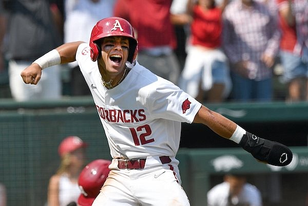 Arkansas center fielder Tavian Josenberger celebrates Friday, June 2, 2023, after scoring on a three-run, bases-clearing single by designated hitter Kendall Diggs during the fourth inning of the Razorbacks’ 13-6 win over Santa Clara in the first round of the NCAA Fayetteville Regional at Baum-Walker Stadium in Fayetteville.