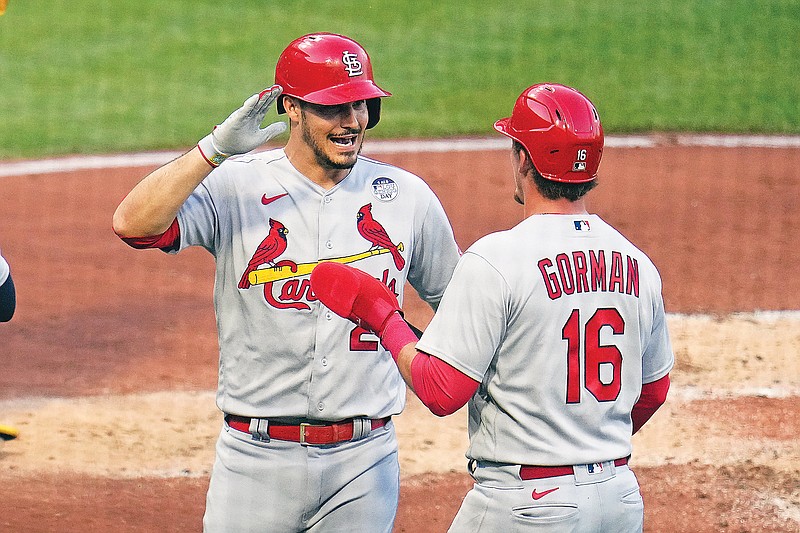 Nolan Arenado celebrates with Cardinals teammate Nolan Gorman after hitting a two-run home run during the third inning of Friday night’s game against the Pirates in Pittsburgh. (Associated Press)