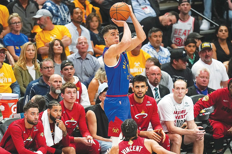 Nuggets forward Michael Porter Jr. shoots a 3-pointer during the second half of Thursday night’s Game 1 of the NBA Finals against the Heat in Denver. (Associated Press)