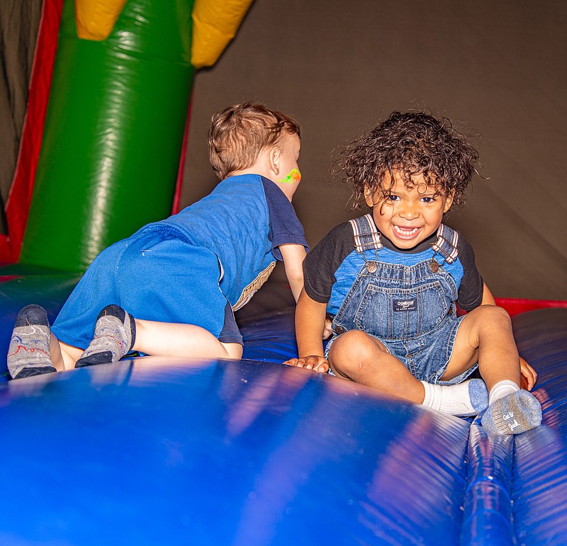Oliver Stafford has fun in the bounce house at the Foster Family Fun Night put on by Capital West Christian Church Saturday, June 3, 2023.  (Ken Barnes/News Tribune)