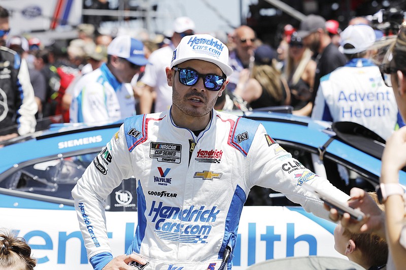 Kyle Larson stands on pit road as he waits for a NASCAR Cup Series auto race at Kansas Speedway in Kansas City, Kan., in this May 7, 2023 file photo. (AP/Colin E. Braley)