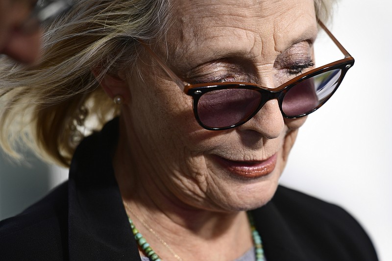 FILE - Victoria Valentino prepares to speak to the media after Bill Cosby was found guilty in this sexual assault retrial at the Montgomery County Courthouse on April 26, 2018, in Norristown, Pa. Valentino, former Playboy model who alleges Bill Cosby drugged and raped her and another woman in 1969, sued the entertainer Thursday, June 1, 2023, in Los Angeles under a new California law that suspends the statute of limitations on sex abuse claims. In her lawsuit, Victoria Valentino, 80, says she was an actress and singer 54 years ago when she met Cosby. (AP Photo/Corey Perrine, File)