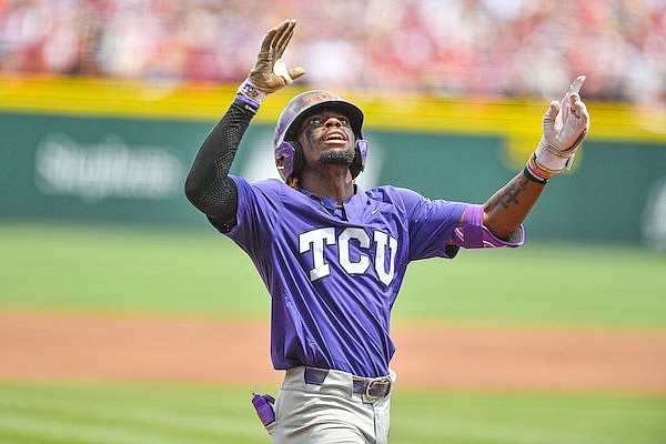 TCU second baseman Tre Richardson (0) celebrates after hitting a grand slam, Sunday, June 4, 2023, during the first inning of the Arkansas Razorbacks’ game against TCU in the second round of the NCAA Fayetteville Regional at Baum-Walker Stadium in Fayetteville.
