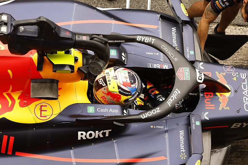 Sergio Perez sits in his car while in the pit lane after the Formula One qualifying session at the Barcelona Catalunya racetrack in Montmelo, just outside of Barcelona, Spain. (Associated Press)