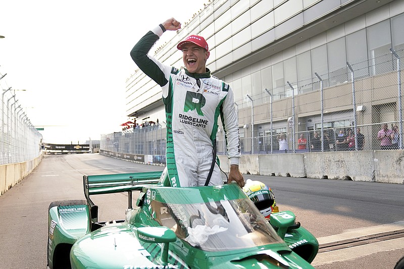 Alex Palou celebrates Sunday after winning the IndyCar Detroit Grand Prix in Detroit. (Associated Press)