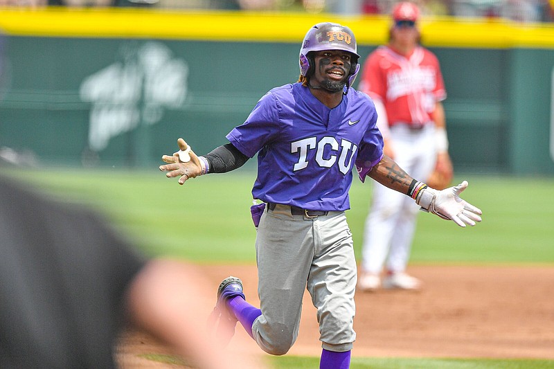 TCU second baseman Tre Richardson (0) celebrates after hitting a grand slam, Sunday, June 4, 2023, during the first inning of the Arkansas Razorbacks’ game against TCU in the second round of the NCAA Fayetteville Regional at Baum-Walker Stadium in Fayetteville. Visit nwaonline.com/photo for today's photo gallery..(NWA Democrat-Gazette/Hank Layton)