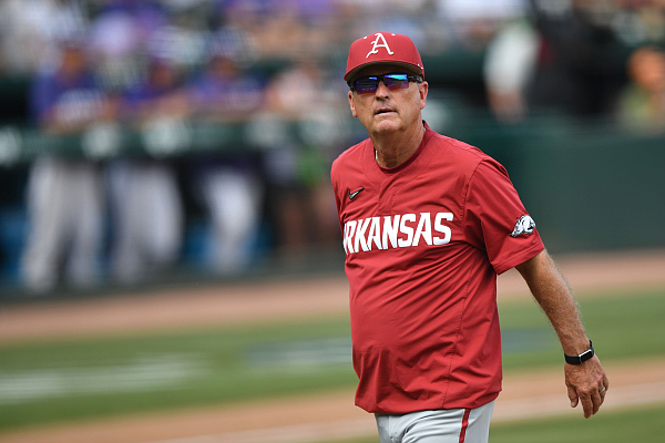 Arkansas coach Dave Van Horn returns to the dugout Monday, June 5, 2023, after making a pitching change during the sixth inning of the Razorbacks’ 12-4 loss to TCU in the NCAA Fayetteville Regional at Baum-Walker Stadium.