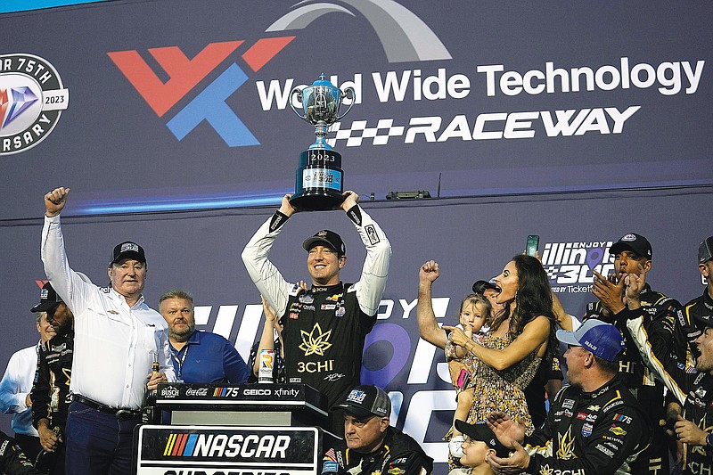 Kyle Busch and car owner Richard Childress (left) celebrate after Sunday night’s win in the NASCAR Cup Series race at World Wide Technology Raceway in Madison, Ill. (Associated Press)